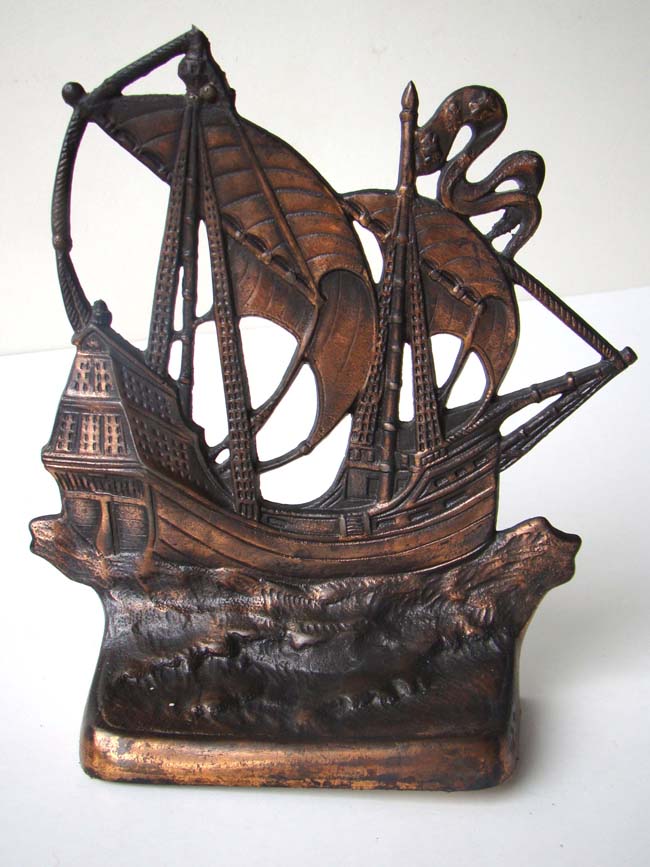 A large pair of cast iron Bookends circa 1926 depicting a 15th century Galleon